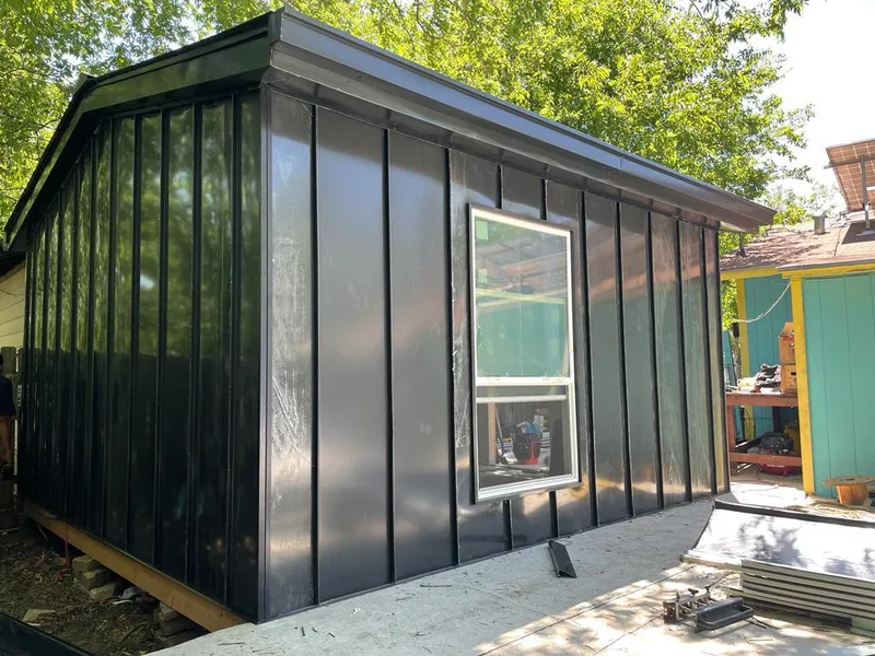 Black standing seam metal wall panels for Roof Inspection in Bel Air North