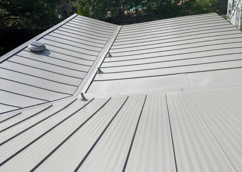 Solar attic fan installed on a metal roof for Roof Ventilation in Bel Air North
